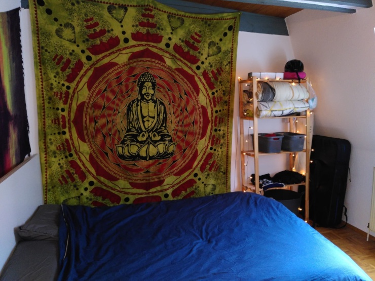 The bigger room of the two, currently used as a bedroom.
