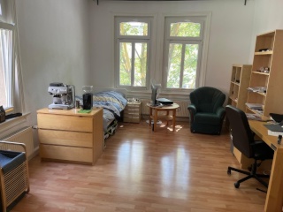 Ad image: Several bright rooms in Catholic student connection