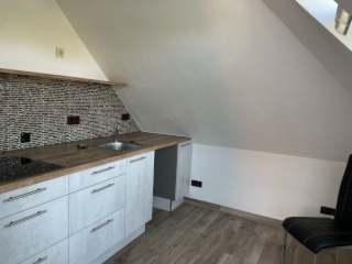 Ad image: Bright attic apartment with fitted kitchen in central location